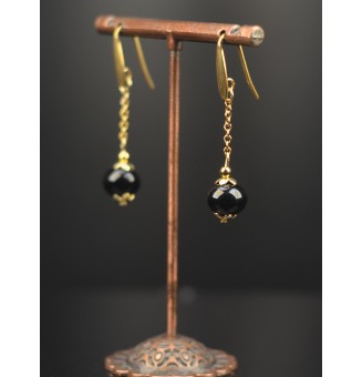 Boucles d’oreilles “noires”...