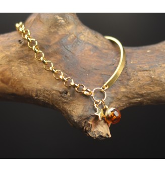Bracelet demi-jonc doré avec perle de verre dégradé ambré et charm étoile