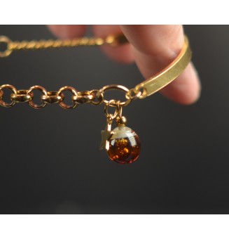 Bracelet demi-jonc doré avec perle de verre dégradé ambré et charm étoile