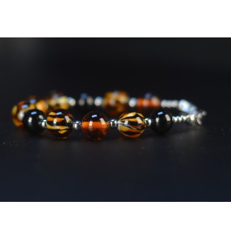 Bracelet artisanal en perles de verre – Motif Léopard, Noir & Ambre