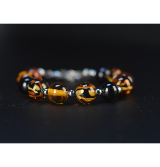Bracelet artisanal en perles de verre – Motif Léopard, Noir & Ambre