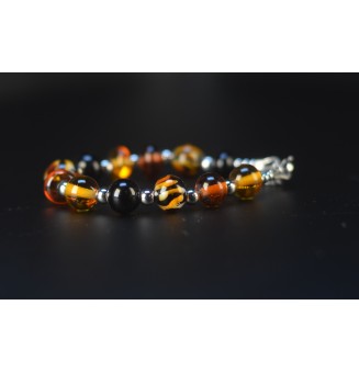 Bracelet artisanal en perles de verre – Motif Léopard, Noir & Ambre